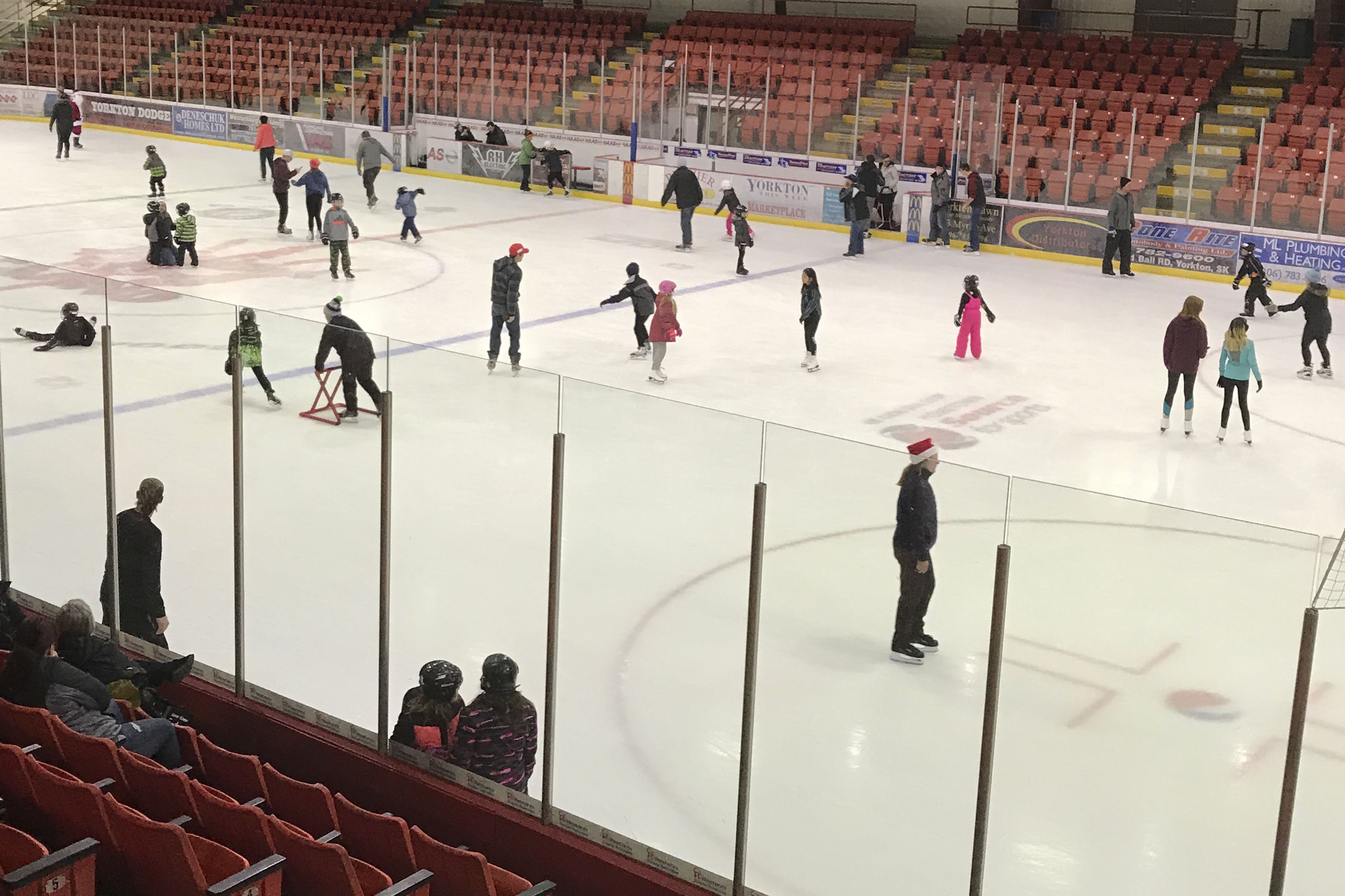 People skating on ice indoors